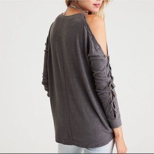 Cold shoulder sweater with lace up sleeves